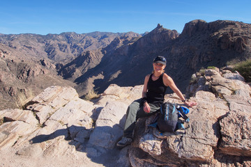 Woman enjoying expansive views at the end of the Blackett's Ridge Trail in the Santa Catalina Mountains near Tucson, Arizona.