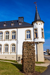 Urspelt Castle in Urspelt, Grand Duchy of Luxembourg against a winter deep blue sky, exterior partial view © Stanislava