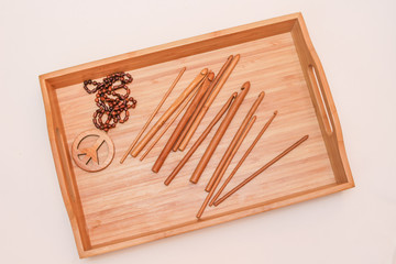 Bamboo tray with wooden pacific sign and crochet hooks