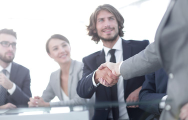 background image of handshake of business partners