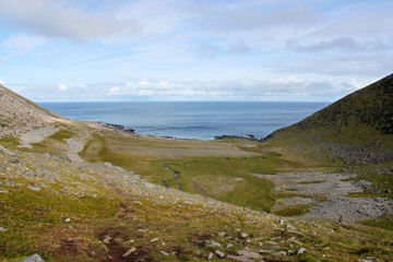 Fototapeta na wymiar Hiking to Knivskjellodden peninsula with blue Atlantic Ocean in the backround. Mageroya Island, Finnmark, Norway