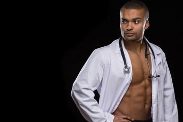 Seductive shirtless African male doctor