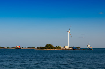 Fototapeta na wymiar Renewable energy with wind turbines at the sea 