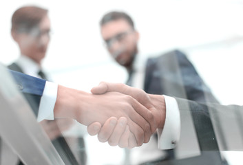 Business men shaking hands. Closeup.