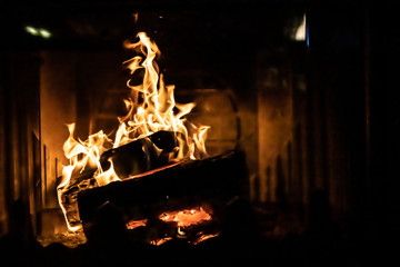 Close up shot of burning firewood in the fireplace