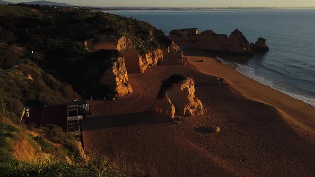 Beautiful sunrise. Dona Ana Beach in Lagos, Algarve, Portugal - 4k footage