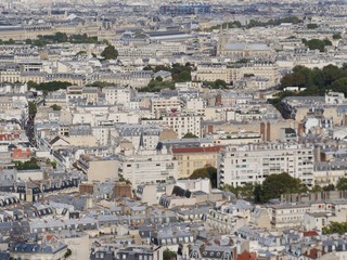 Obraz premium View over the rooftops and houses of Paris, facing east to the Louvre