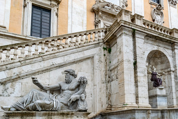Fototapeta na wymiar Statue of the Nile River god on the Palazzo Senatorio in Piazza del Campidoglio Square on Capitoline Hill, Rome, created in first century AD