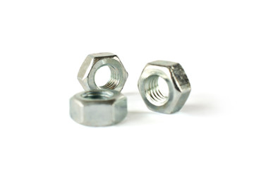 Closeup of nuts isolated on white. Self Drilling screws. Isolated fasteners. Connecting material on white background