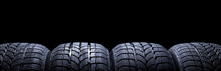 Car tires isolated on black background