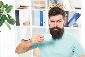 Naklejka na ściany i meble Head of department. Head office concept. Man bearded manager businessman entrepreneur wear golden crown on head. Relaxed top manager drinking coffee. Confident boss enjoying his glory. King of office