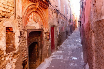 Colorful ancient old and narrow street in medina of Marrakech, Morocco, Africa