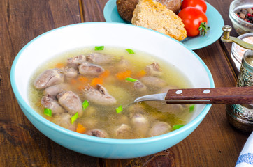 Transparent broth with chicken liver