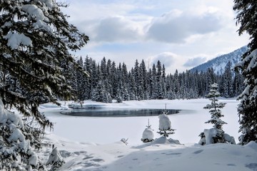 Incredible snowy views from Island Lake in Fernie, British Columbia, Canada.  The majestic winter background is an absolutely beautiful place to go hiking or snowshoeing with fresh fallen snow.