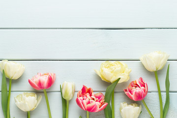 Spring flowers tulips on pastel colors background. Retro vintage style.