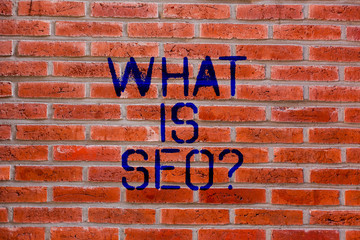 Text sign showing What Is Seo. Conceptual photo Search Engine Keywording Marketing Online searching Strategies Brick Wall art like Graffiti motivational call written on the wall