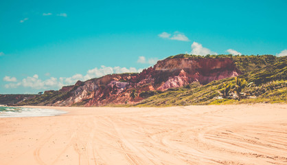 Leading sand tracks tyre trail on a beach in Conde,Paraiba, Brazil