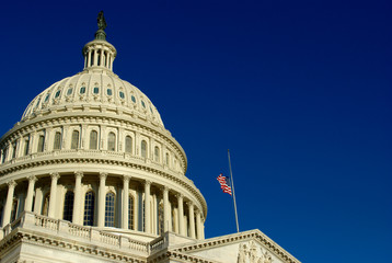 United States Capitol having the flag at half-mast