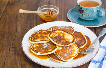 fried pancakes with sugar on plate to Shrovetide