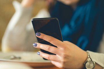 Close Up on Woman's hand holding Smart Phone mobile text message internet browsing connection app