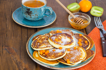 fried pancakes with sugar on plate to Shrovetide