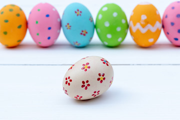 Happy Easter. Easter eggs concept. Row Easter eggs on blue background and copy space for advertisers.