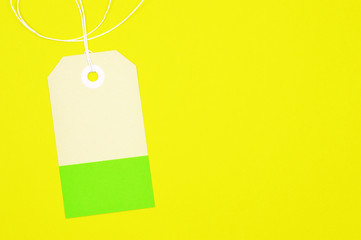 clipped rectangle paper tag on yellow background horizontal template