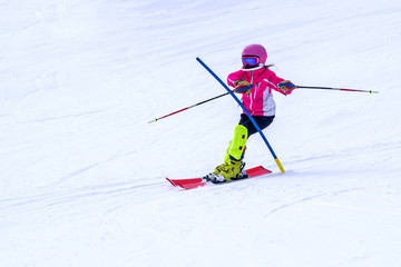 People are enjoying downhill skiing and snowboarding	