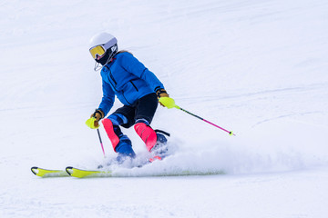 People are enjoying downhill skiing and snowboarding	