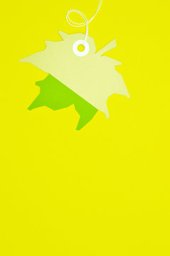 leaf paper tag on yellow background vertical template
