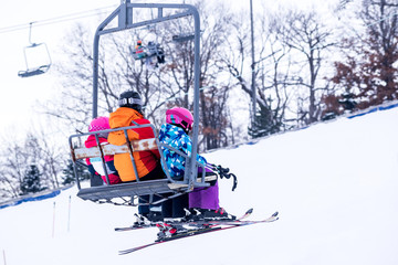 People are enjoying downhill skiing and snowboarding	