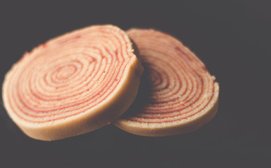 Bolo de rolo (swiss roll, roll cake) Brazilian dessert on black background - Isolated 