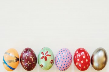 Easter egg painted into bunny face with long and fold ear, Easter holiday concept, fancy eggs
