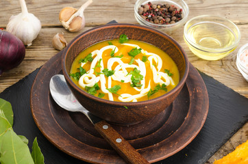 Vegetable puree, vegetarian soup with sour cream and greens.