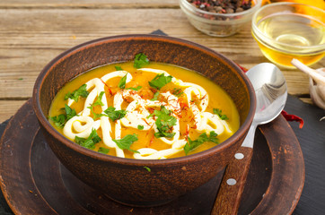Vegetable puree, vegetarian soup with sour cream and greens.