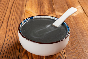 side view bow of black sesame paste