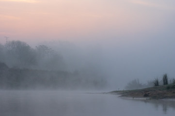 Fototapeta na wymiar Morning Mist in the Sunrise over River
