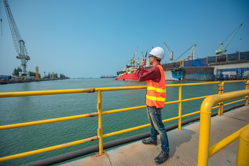 supervisor, port controller, harbor master or worker  in command on the terminal port for safety and control security during the operation of ship in port