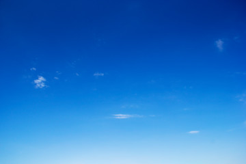 Blue sky background and white clouds soft focus, and copy space