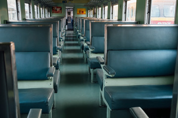 Naklejka premium Seat on the old train with evening sun.