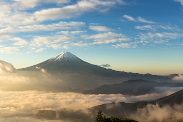 Fuji mountain and the mist over Lake Kawaguchiko at beautiful sunrise , Yamanashi, Japan, Mount Fuji or Fujisan located on Honshu Island, is the highest mountain in Japan.