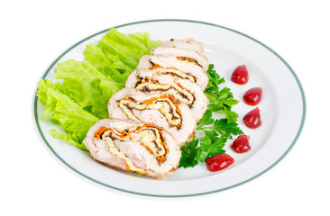 Plate of lettuce and slices of chicken roll.