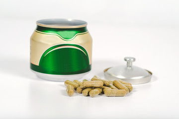 Alternative herb capsule and fresh herb background ,health concept.
