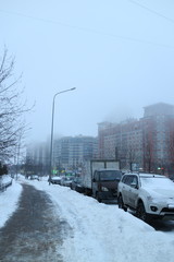 Misty winter morning in a city block