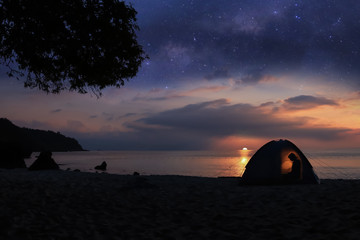 Camping on the beach with million stars galaxy