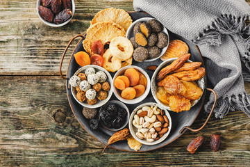 Homemade sweets from dried fruits without sugar and different nuts.
