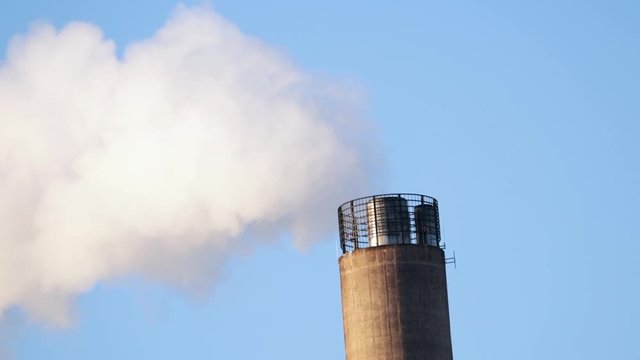 Smoke coming out of power plant chimney