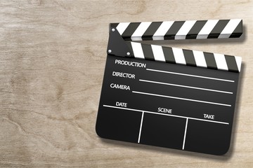 Obraz premium Clap board on wooden background