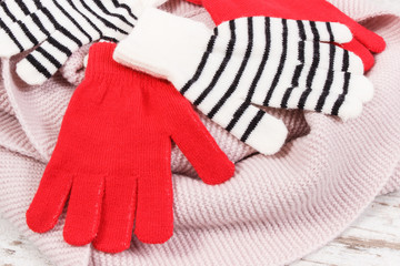 Woolen womanly gloves and scarf, clothing for autumn or winter concept