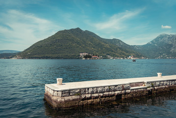 Landscape view of Perast, Montenegro with dock, sea and mountain view
